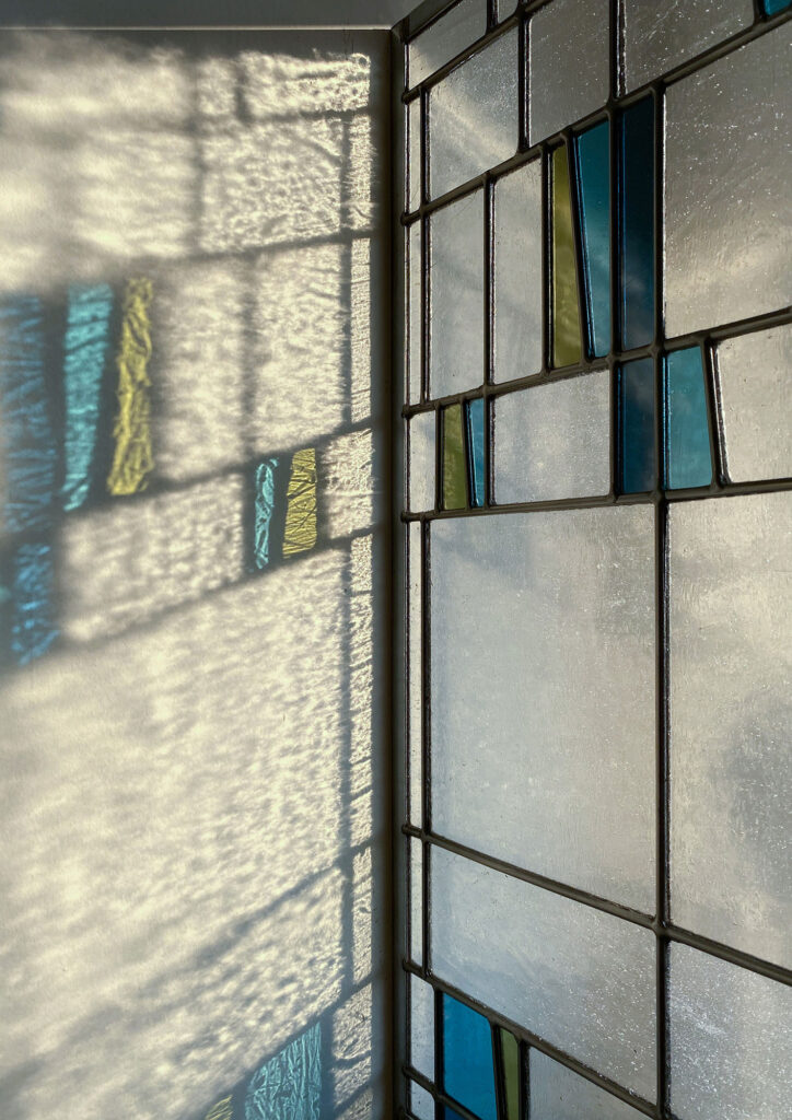 Stained glass leadlight in surf refracting light