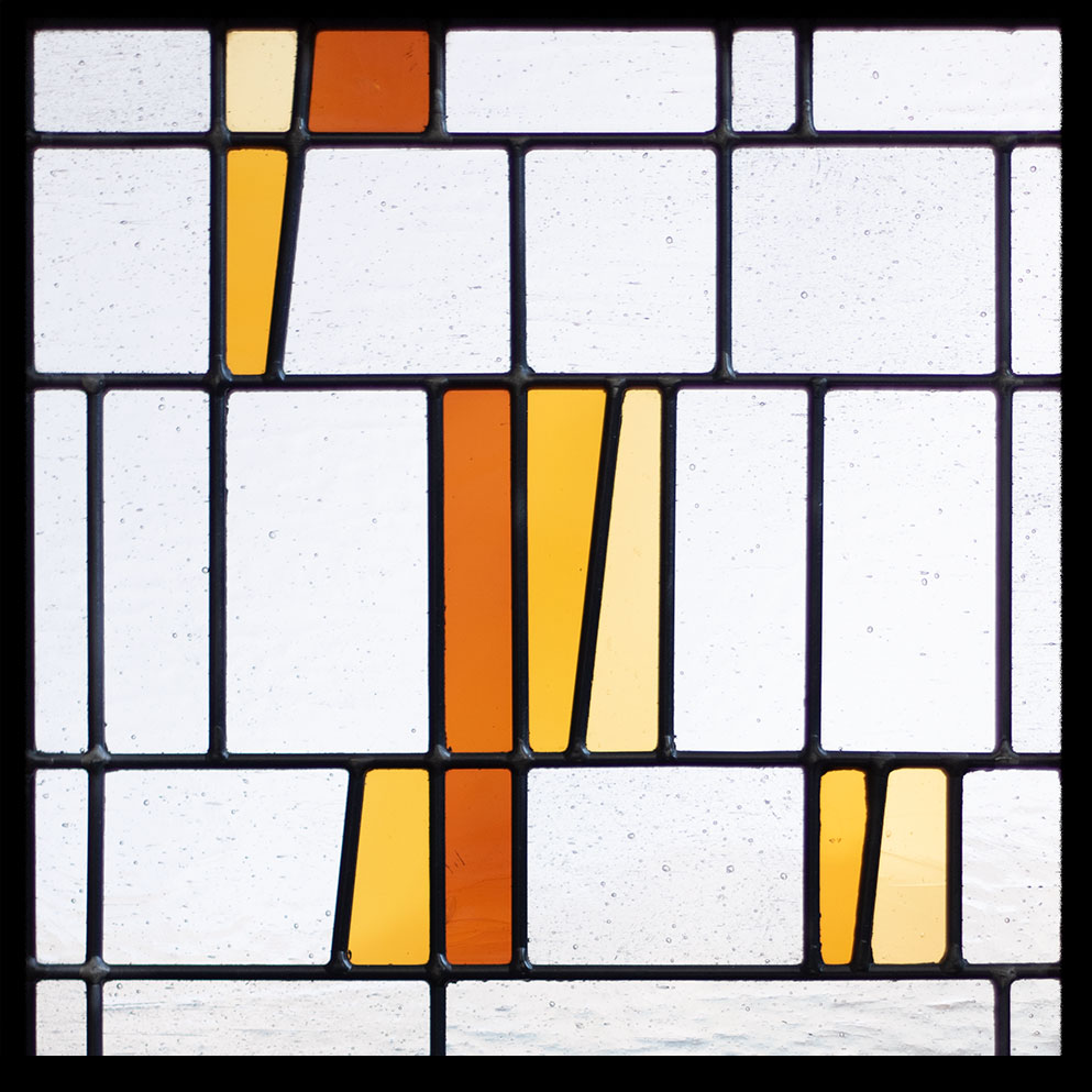 Slanted stained glass window design in tangerine
