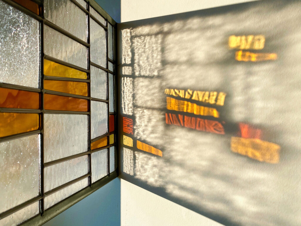 Stained glass leadlight in tangerine refracting light