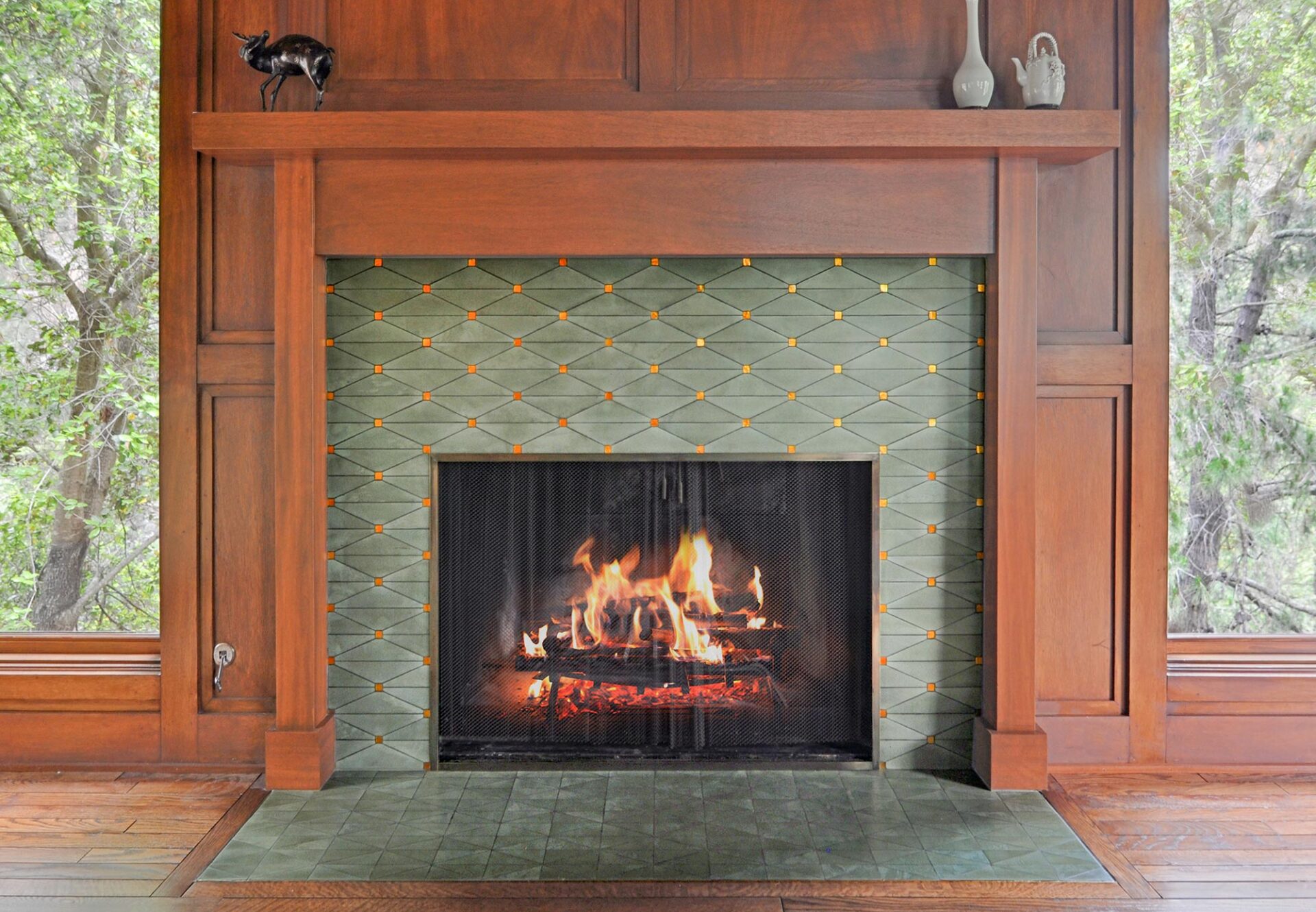 Mosaic fireplace with cranbrook moss design